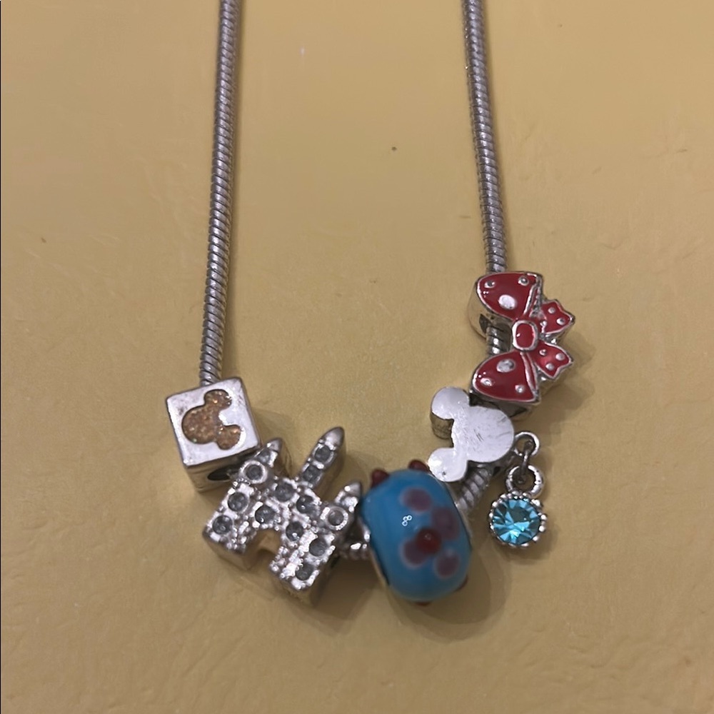 Silver tone Necklace with some Disney  Charms . Make offer!  cute disney theme